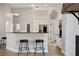 Kitchen view featuring a breakfast bar, white cabinets, granite countertops and pantry at 32421 Wolfs Trl, Sorrento, FL 32776
