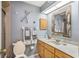 Nautical themed full bathroom with updated fixtures and finishes for a fresh, relaxing space at 3247 S Polk Ave, Lakeland, FL 33803