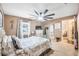 Bedroom features large ceiling fan, closet and window providing ample natural light at 3247 S Polk Ave, Lakeland, FL 33803