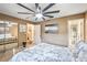 Bright bedroom offers ample closet space, a large ceiling fan, and access to en-suite bathroom at 3247 S Polk Ave, Lakeland, FL 33803