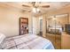 Well-lit bedroom with mirrored closet doors and a wooden bookshelf at 3247 S Polk Ave, Lakeland, FL 33803