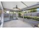 Screened-in back porch with an outdoor ceiling fan and natural light at 3247 S Polk Ave, Lakeland, FL 33803