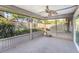 Enclosed back porch with a ceiling fan and views of lush greenery at 3247 S Polk Ave, Lakeland, FL 33803