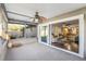 Covered back porch featuring a ceiling fan and a view of the backyard at 3247 S Polk Ave, Lakeland, FL 33803