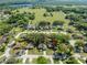 Residential neighborhood with tree-lined streets, well-maintained homes, and proximity to green spaces and a lake at 5416 Oxford Manor Cir, Lakeland, FL 33810
