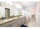 Bright bathroom features a double vanity, shower, soaking tub, and recessed lighting at 5416 Oxford Manor Cir, Lakeland, FL 33810