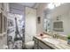 Neutral bathroom featuring a combination shower and tub with Paris themed shower curtain at 5416 Oxford Manor Cir, Lakeland, FL 33810