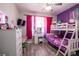 Vibrant bedroom with a bunk bed, a vanity, and wood-look flooring at 5416 Oxford Manor Cir, Lakeland, FL 33810