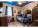 The bedroom features a bunk bed, blue ceiling, and vinyl plank flooring at 5416 Oxford Manor Cir, Lakeland, FL 33810