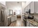 Well-equipped kitchen with stainless steel appliances and an open view to the dining area at 5416 Oxford Manor Cir, Lakeland, FL 33810