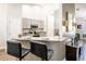Kitchen with breakfast bar featuring sleek black stools and modern countertops at 5416 Oxford Manor Cir, Lakeland, FL 33810