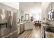 Bright kitchen with stainless steel appliances and open access to the dining room at 5416 Oxford Manor Cir, Lakeland, FL 33810