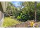 Private, fenced backyard featuring mature trees and landscaping, creating a serene outdoor space at 638 Coral Way, Winter Springs, FL 32708