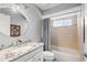 A remodeled bathroom features a granite countertop, new lighting, and a tiled shower and bath at 638 Coral Way, Winter Springs, FL 32708