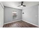 A well-lit bedroom features stylish wood floors, neutral walls, and a modern ceiling fan at 638 Coral Way, Winter Springs, FL 32708