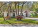Attractive one-story home with a lush front yard and mature trees in a serene setting at 638 Coral Way, Winter Springs, FL 32708