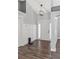 Bright foyer with wood-look flooring, paneled walls, and modern lighting at 638 Coral Way, Winter Springs, FL 32708