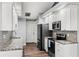 Kitchen showcasing granite counters, stainless appliances and modern finishes at 638 Coral Way, Winter Springs, FL 32708