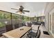 Spacious screened lanai features tile flooring, ceiling fans, and outdoor seating at 638 Coral Way, Winter Springs, FL 32708