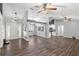 Open-concept living room with wood floors, high ceilings, and modern lighting at 638 Coral Way, Winter Springs, FL 32708