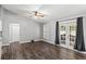 Spacious living room featuring wood floors, a ceiling fan and sliding glass doors at 638 Coral Way, Winter Springs, FL 32708