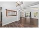 Inviting living room with hardwood floors, stylish mirror, and natural light at 638 Coral Way, Winter Springs, FL 32708