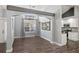 Bright and airy living room with wood floors, elegant lighting, and access to the kitchen at 638 Coral Way, Winter Springs, FL 32708