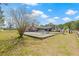 Expansive backyard showcasing an above-ground pool, covered patio, and ample space for outdoor recreation at 4305 Hamilton Rd, Lakeland, FL 33811