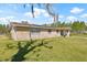 Beautiful brick home featuring a lush green lawn and mature trees at 4305 Hamilton Rd, Lakeland, FL 33811
