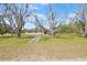 Sprawling front yard with a well-maintained lawn and a charming brick house at 4305 Hamilton Rd, Lakeland, FL 33811