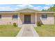Inviting home exterior with a brick facade and well-maintained walkway at 4305 Hamilton Rd, Lakeland, FL 33811