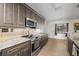 A spacious kitchen is equipped with stainless steel appliances and mosaic tile backsplash at 4305 Hamilton Rd, Lakeland, FL 33811