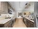Modern kitchen featuring granite countertops, stainless steel appliances, and ample cabinet space at 4305 Hamilton Rd, Lakeland, FL 33811
