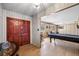 Spacious living area featuring a wooden accent wall and a pool table at 4305 Hamilton Rd, Lakeland, FL 33811