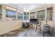Sunroom featuring light walls, multiple windows, and concrete floors offering views of the property at 4305 Hamilton Rd, Lakeland, FL 33811