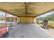 This spacious covered patio has room for parking, grilling, and storing outdoor equipment at 4305 Hamilton Rd, Lakeland, FL 33811