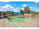 Above-ground pool surrounded by a wooden deck with ample space for seating and outdoor enjoyment at 4305 Hamilton Rd, Lakeland, FL 33811