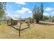 Spacious property showing play equipment and a building for livestock or farm animals at 4305 Hamilton Rd, Lakeland, FL 33811