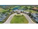 Aerial view showcasing the clubhouse, golf course, and surrounding landscape, providing a glimpse of community amenities at 8427 Prestbury Dr, Orlando, FL 32832