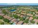 Aerial view of property in the community, showcasing nearby lake, golf course, and convenient location at 8427 Prestbury Dr, Orlando, FL 32832