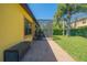 Property view showcasing a backyard with a patio, lawn, and screened enclosure, perfect for outdoor enjoyment at 8427 Prestbury Dr, Orlando, FL 32832