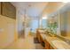 A spacious bathroom features dual sinks, a soaking tub, and a separate walk-in shower at 8427 Prestbury Dr, Orlando, FL 32832