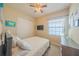 Cozy bedroom with a ceiling fan, closet, and natural light from the window, creating a comfortable atmosphere at 8427 Prestbury Dr, Orlando, FL 32832