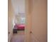 Hallway view of a bedroom, featuring a ceiling fan and plenty of natural light at 8427 Prestbury Dr, Orlando, FL 32832