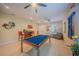 Well-appointed game room with a billiard table, seating, and stylish decor, creating a fun and inviting atmosphere at 8427 Prestbury Dr, Orlando, FL 32832