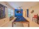 Spacious game room with a billiard table, stylish decor, and ample lighting, perfect for entertainment at 8427 Prestbury Dr, Orlando, FL 32832
