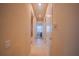 A hallway featuring access to rooms, doors, and tile flooring at 8427 Prestbury Dr, Orlando, FL 32832