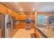 Modern kitchen featuring stainless steel appliances, granite countertops, and ample cabinet space at 8427 Prestbury Dr, Orlando, FL 32832