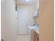 Laundry room with a washer, dryer, and utility sink for added convenience at 8427 Prestbury Dr, Orlando, FL 32832