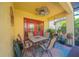 Patio with outdoor table and chairs, ceiling fan, and plants that create a inviting and comfortable space at 8427 Prestbury Dr, Orlando, FL 32832